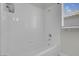 Bathroom featuring a shower/tub combination with white tile surround at 3604 N Campbell Rd, Las Vegas, NV 89129