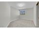 Cozy bedroom with neutral carpet and a bright window at 3604 N Campbell Rd, Las Vegas, NV 89129