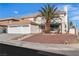 Charming two-story home with a three-car garage and beautiful landscaping at 3604 N Campbell Rd, Las Vegas, NV 89129
