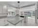 Bright kitchen featuring white cabinets, granite countertops, and backyard views at 3604 N Campbell Rd, Las Vegas, NV 89129