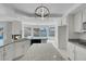 Well-lit kitchen with granite countertops, a kitchen island and backyard access at 3604 N Campbell Rd, Las Vegas, NV 89129