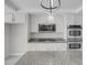 Modern kitchen featuring stainless steel appliances and granite countertops at 3604 N Campbell Rd, Las Vegas, NV 89129