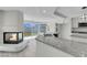 Updated kitchen with granite counters, a modern sink, and a cozy fireplace nearby at 3604 N Campbell Rd, Las Vegas, NV 89129
