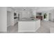 Spacious kitchen with white cabinetry, granite countertops, stainless steel appliances, and center island at 3604 N Campbell Rd, Las Vegas, NV 89129