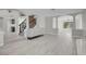 Living room features stairs, wood-look flooring, archway to other rooms at 3604 N Campbell Rd, Las Vegas, NV 89129