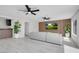Modern living room featuring recessed lights, ceiling fans, wood accent wall, and ample seating at 3604 N Campbell Rd, Las Vegas, NV 89129