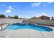 This backyard boasts a pool and integrated hot tub for relaxing and entertaining at 3604 N Campbell Rd, Las Vegas, NV 89129
