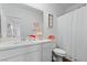 Well-lit bathroom featuring a single vanity, modern fixtures, and a shower with a white curtain at 3729 Canis Minor Ln # 10206, Henderson, NV 89052