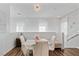 Bright dining area features a modern chandelier, large windows, and elegant white dining set at 3729 Canis Minor Ln # 10206, Henderson, NV 89052