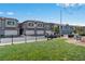 Community townhomes with attached garages and well-maintained lawns and a dog park at 3729 Canis Minor Ln # 10206, Henderson, NV 89052