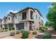 Townhouse exterior showcasing the garage, balcony, and well-maintained landscaping at 3729 Canis Minor Ln # 10206, Henderson, NV 89052
