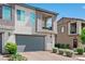Stylish townhome featuring a private balcony and a two-car garage at 3729 Canis Minor Ln # 10206, Henderson, NV 89052