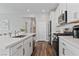 Well-lit kitchen featuring white cabinets, quartz countertops, stainless appliances, and modern backsplash at 3729 Canis Minor Ln # 10206, Henderson, NV 89052