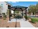 Community pavilion with a picnic table and grill area, perfect for outdoor gatherings at 3729 Canis Minor Ln # 10206, Henderson, NV 89052