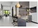 Stylish bar area with seating, sleek countertops, and a built-in wine refrigerator at 38 Skybird Ct, Las Vegas, NV 89135