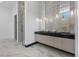 Spa-like bathroom features dual sinks with marble countertops and a glass shower at 38 Skybird Ct, Las Vegas, NV 89135