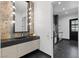 Modern bathroom with sleek vanity, contemporary mirror lighting, and access to the stylish kitchen at 38 Skybird Ct, Las Vegas, NV 89135