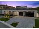 Striking contemporary home with a spacious three-car garage and modern architectural details at 38 Skybird Ct, Las Vegas, NV 89135