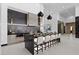 Modern kitchen with large island, sleek cabinetry, stainless steel appliances, and pendant lighting at 38 Skybird Ct, Las Vegas, NV 89135
