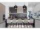 Modern kitchen featuring an island with seating, stylish pendant lights, and stainless steel appliances at 38 Skybird Ct, Las Vegas, NV 89135