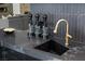 Modern kitchen boasts sleek countertops, a gooseneck faucet, and stylish decor at 38 Skybird Ct, Las Vegas, NV 89135