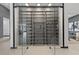 Contemporary glass-enclosed wine room with custom shelving and ample storage space at 38 Skybird Ct, Las Vegas, NV 89135