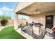 Inviting covered back patio with outdoor seating and built-in grill area at 4015 Galiceno Dr, Las Vegas, NV 89122
