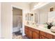 Bright bathroom features a vanity with double sinks and a shower-tub combination at 4015 Galiceno Dr, Las Vegas, NV 89122