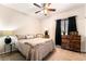 Cozy bedroom with a ceiling fan, dresser, and comfortable furnishings at 4015 Galiceno Dr, Las Vegas, NV 89122