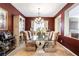 Formal dining room featuring a stylish glass table and elegant decor for sophisticated gatherings at 4015 Galiceno Dr, Las Vegas, NV 89122