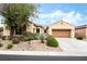 Charming single-story home with a well-maintained xeriscaped front yard and a two-car garage at 4015 Galiceno Dr, Las Vegas, NV 89122