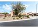 Charming single-story home with desert landscaping and a mature tree in the front yard at 4015 Galiceno Dr, Las Vegas, NV 89122
