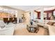 Open-concept living room featuring stylish furnishings and seamless flow to kitchen at 4015 Galiceno Dr, Las Vegas, NV 89122