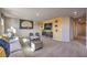 Cozy bonus room with comfortable seating, carpet flooring, and modern decor at 4439 Bayley Skye Ave # 105, Las Vegas, NV 89141