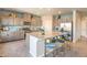 Modern kitchen with granite countertops, stainless steel appliances, and island seating at 4439 Bayley Skye Ave # 105, Las Vegas, NV 89141
