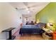 Comfortable bedroom with neutral walls, tile floors, ceiling fan, and patio access at 4565 Halbert Ave, Las Vegas, NV 89110