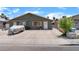 Charming single-story home with large driveway, mature landscaping, and neutral color scheme at 4565 Halbert Ave, Las Vegas, NV 89110