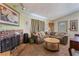 Inviting living room boasts brick fireplace and tiled floors at 4565 Halbert Ave, Las Vegas, NV 89110