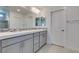 Bathroom featuring double sinks and a tiled backsplash at 4633 Fragrant St, North Las Vegas, NV 89031
