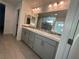 Bathroom featuring double vanity, modern mirrors, and stylish tile flooring at 4633 Fragrant St, North Las Vegas, NV 89031