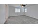 Spacious bedroom with carpet flooring, ceiling fan and bright white walls at 4633 Fragrant St, North Las Vegas, NV 89031
