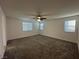 Expansive bedroom with plush carpeting, ceiling fan and bright windows at 4633 Fragrant St, North Las Vegas, NV 89031