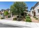 Charming two-story home with a brick-paved driveway, mature landscaping, and an inviting front entrance at 4633 Fragrant St, North Las Vegas, NV 89031