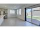 Kitchen with gray cabinets, stainless steel appliances, and sliding doors leading to a private backyard at 4633 Fragrant St, North Las Vegas, NV 89031