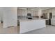Well-equipped kitchen featuring an island, stainless steel appliances, and gray cabinets at 4633 Fragrant St, North Las Vegas, NV 89031
