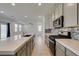Beautiful kitchen showcasing an island, modern appliances, and stylish backsplash at 4633 Fragrant St, North Las Vegas, NV 89031