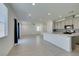 Bright, open-concept living space featuring tile floors and recessed lighting open to the kitchen at 4633 Fragrant St, North Las Vegas, NV 89031