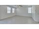 Large, airy living room featuring tile floors and lots of natural light from large windows at 4633 Fragrant St, North Las Vegas, NV 89031