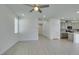 Bright living room with tile flooring, ceiling fan and access to the kitchen area at 4633 Fragrant St, North Las Vegas, NV 89031