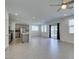 Open-concept living and kitchen area featuring tile floors, recessed lighting, and stainless steel appliances at 4633 Fragrant St, North Las Vegas, NV 89031